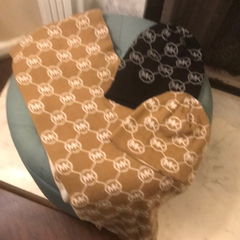 Two Michael Kors hats and a scarf